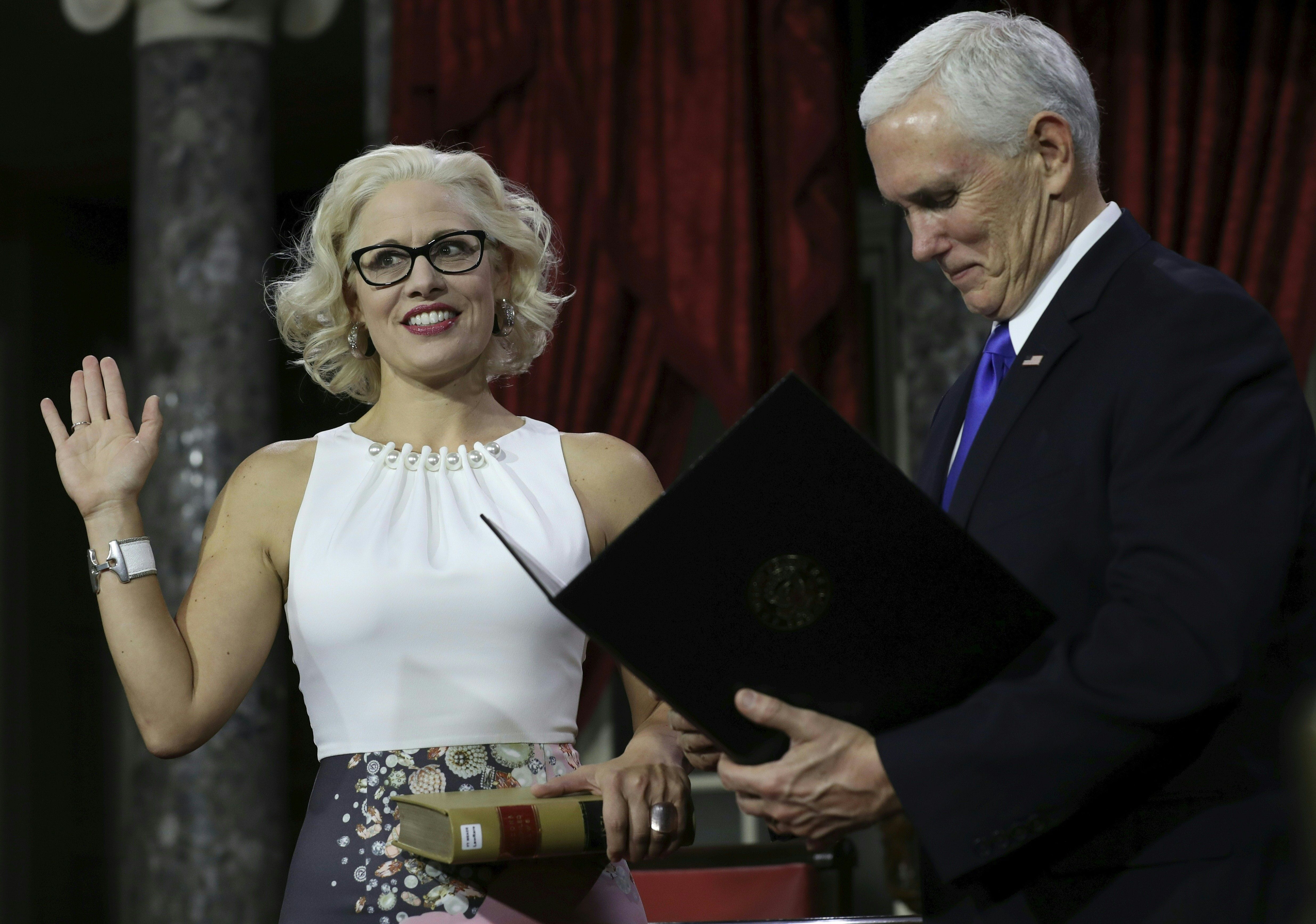 First out bisexual Senator Kyrsten Sinema sworn in by Mike Pence