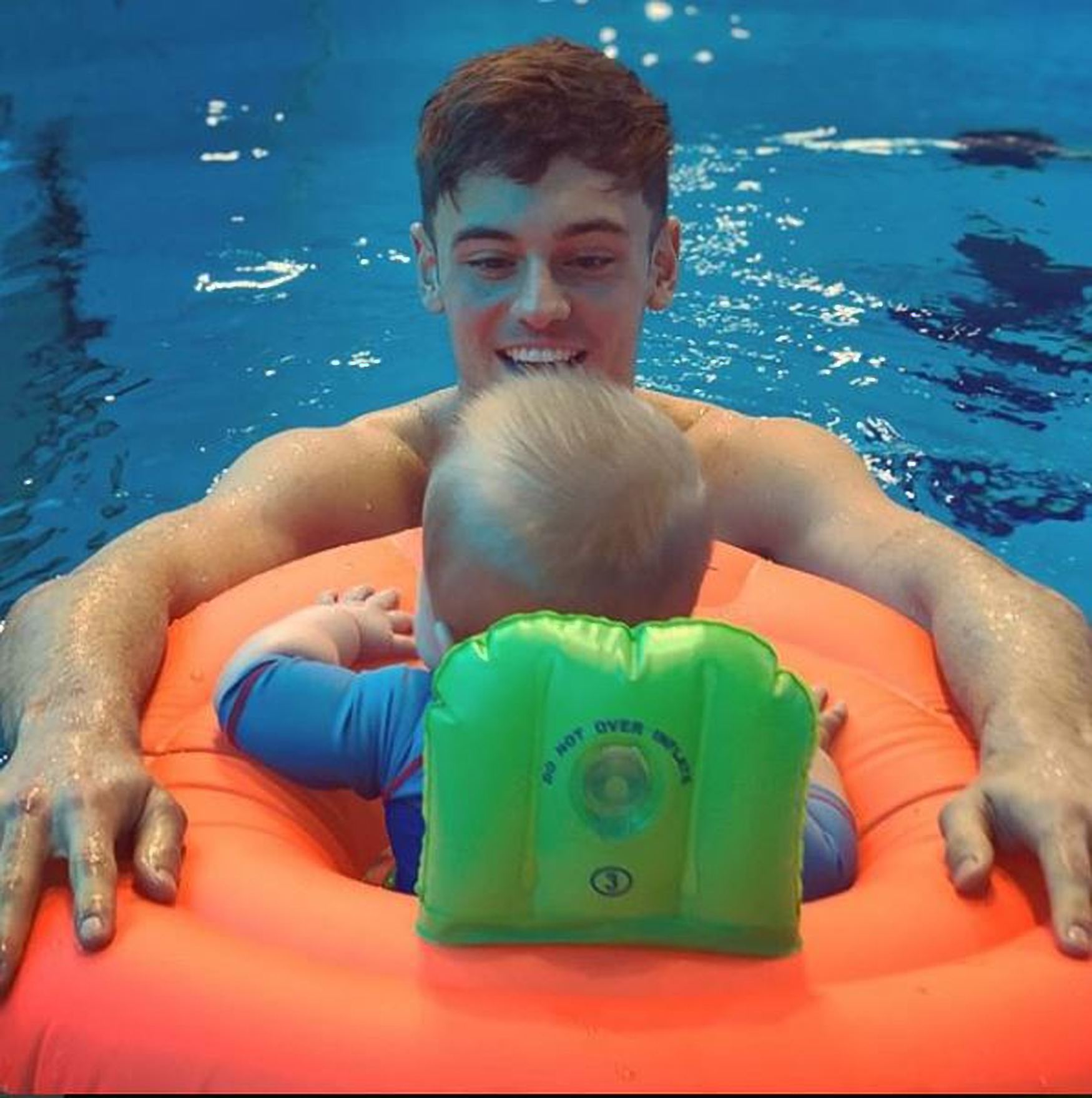 Tom Daley and Dustin Lance Black take son for first swim