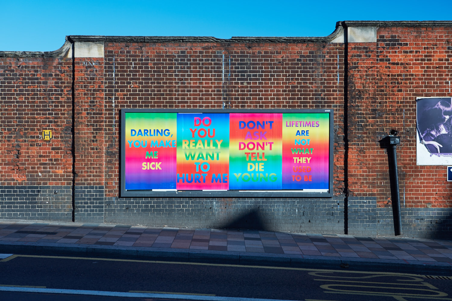 LGBT+ activists edit artist's posters amid fears of being 'traumatic for those living with HIV'