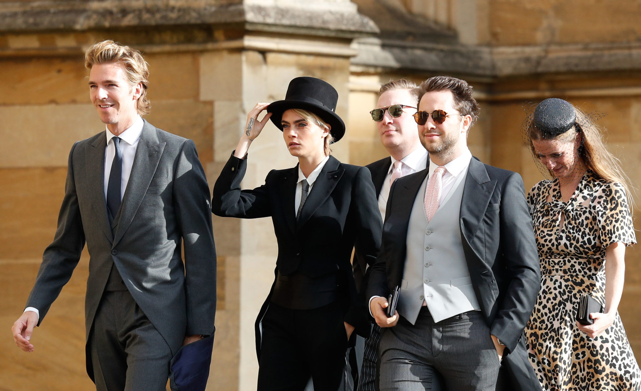 Cara Delevingne stuns in top hat and tuxedo at Princess Eugenie royal wedding