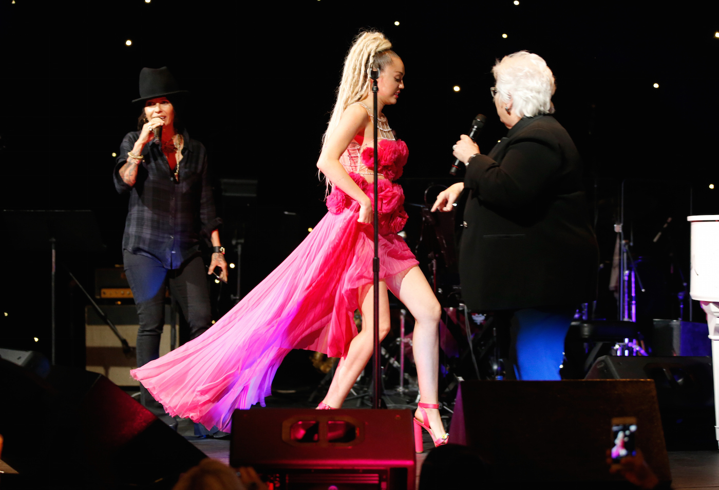 Miley Cyrus did WHAT to a piano for charity?!