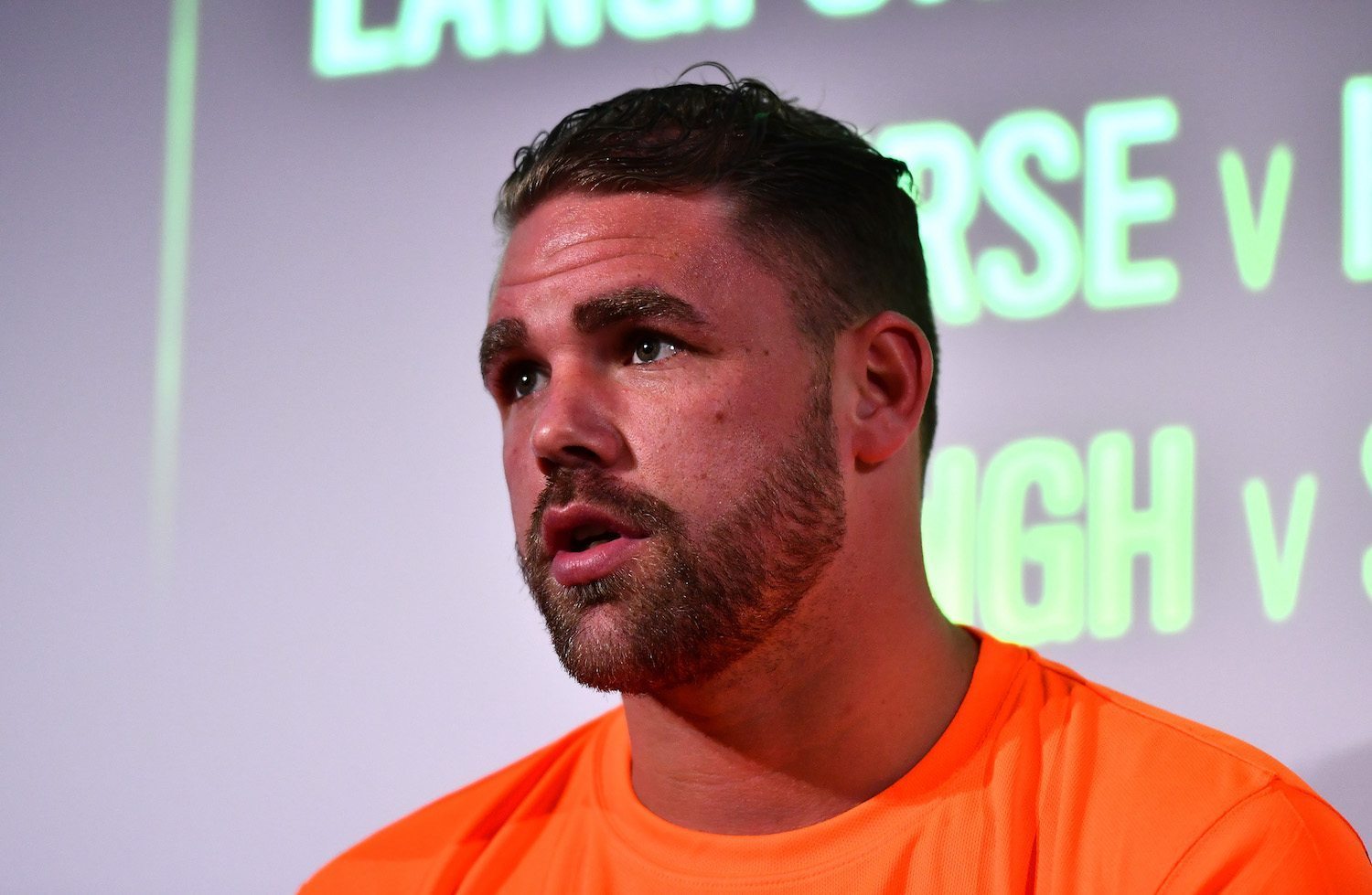 Boxing champ tells 100k followers that kids 'shouldn't see' a man with long hair and earrings