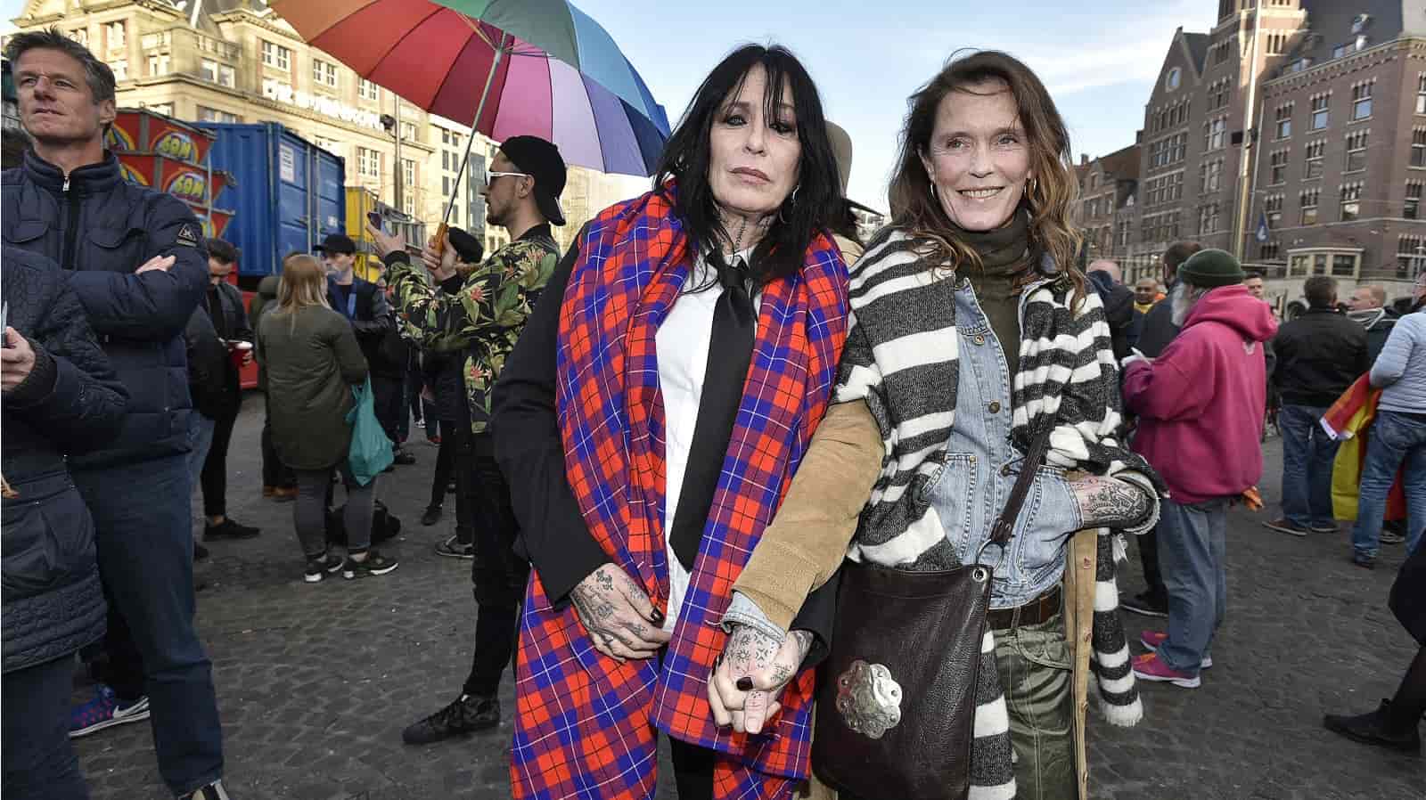 Hundreds of people march holding hands, after gay couple attacked for holding hands