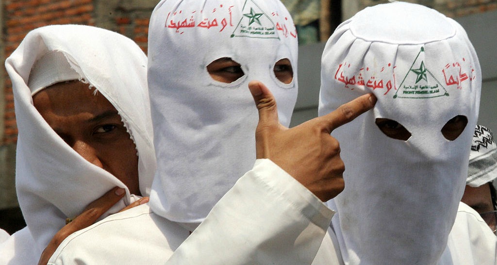 Radical Islamic group raid gay 'sex party', force police to arrest men and seize HIV drugs