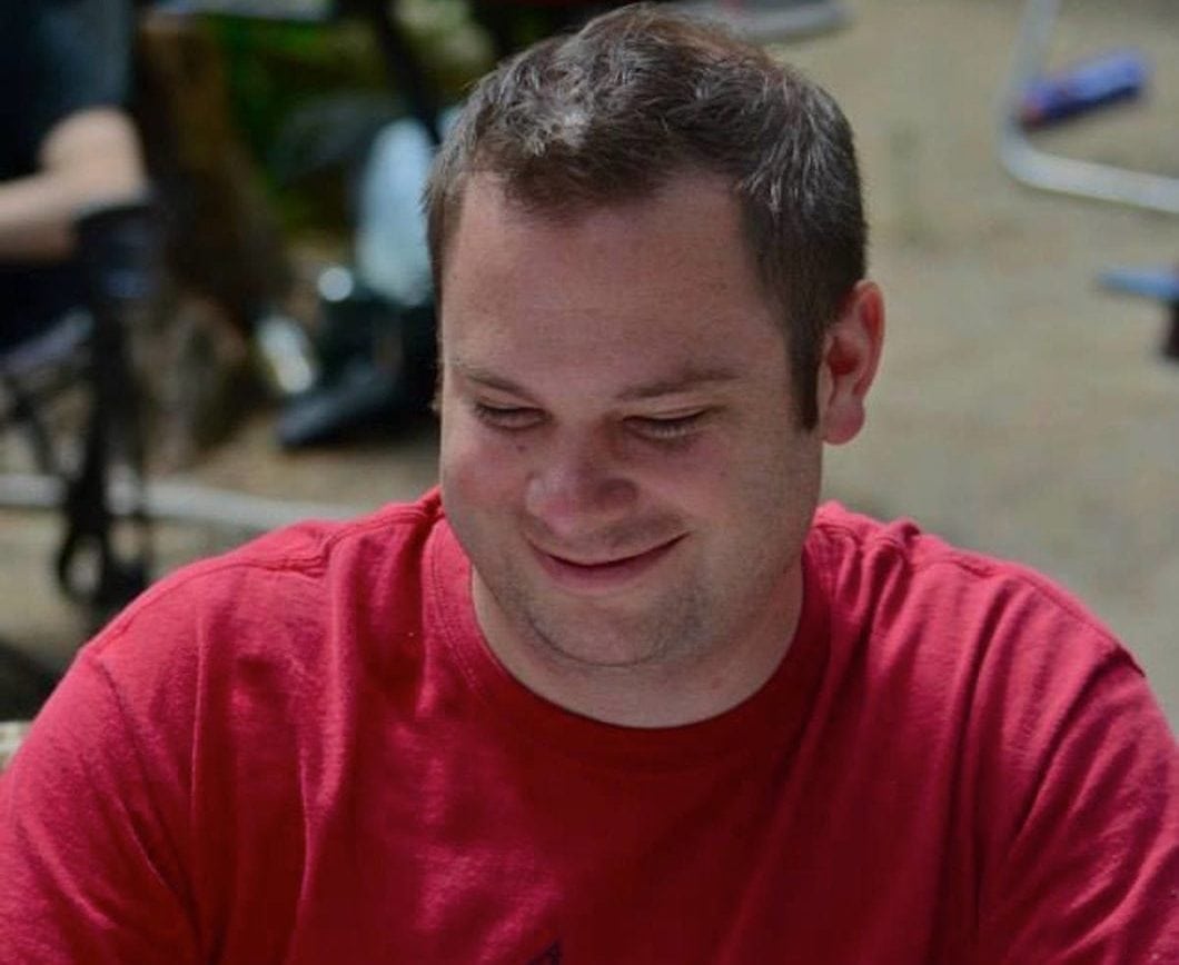 Teacher charged over spying on male roommate