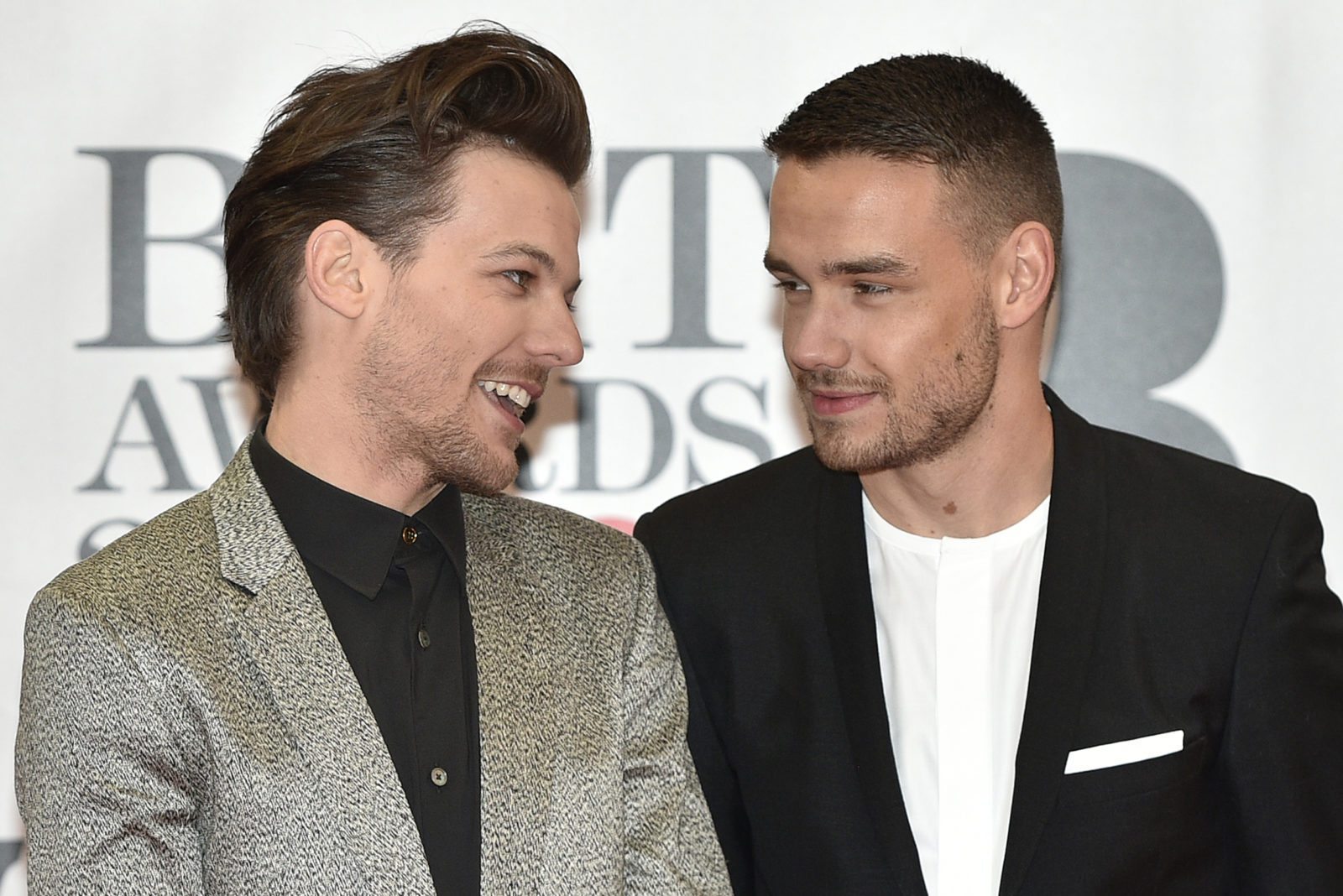 Louis Tomlinson says that rumours of a fling with Harry Styles were disrespectful to his girlfriend