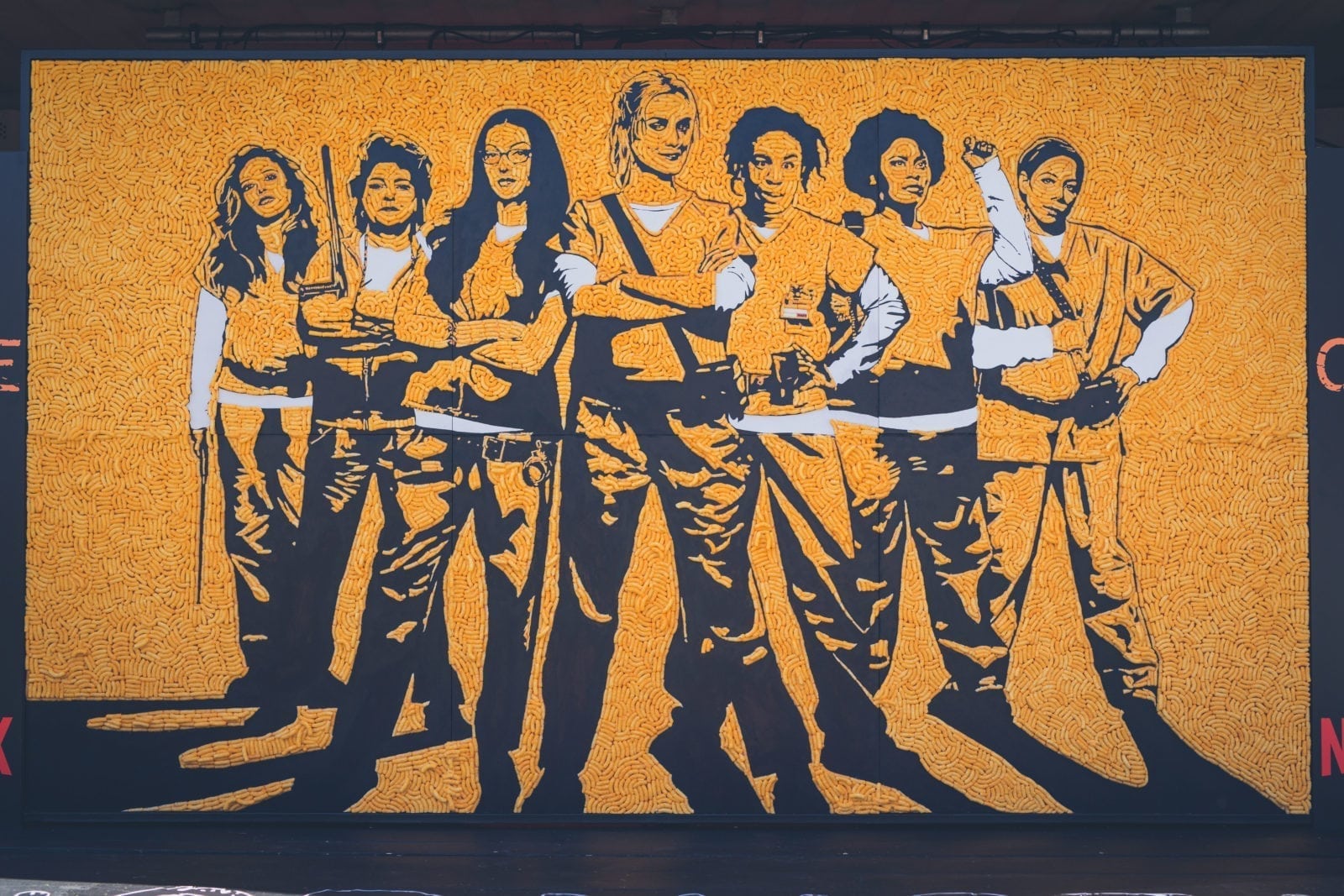 You have to see this Orange is the New Black mural made entirely from cheesy puffs