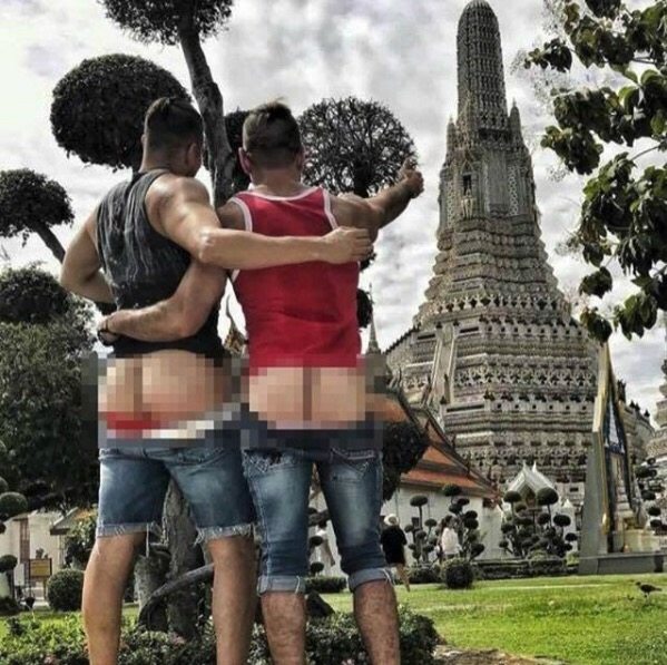 Gay couple arrested in Thailand for baring bums in front of sacred temple have been released