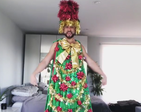 Gay dancer transforms himself into an amazing drag Christmas tree