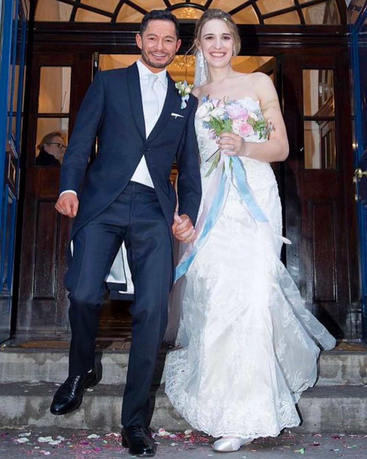 Britain's highest-ranking transgender soldier marries actor in dreamy Disney wedding