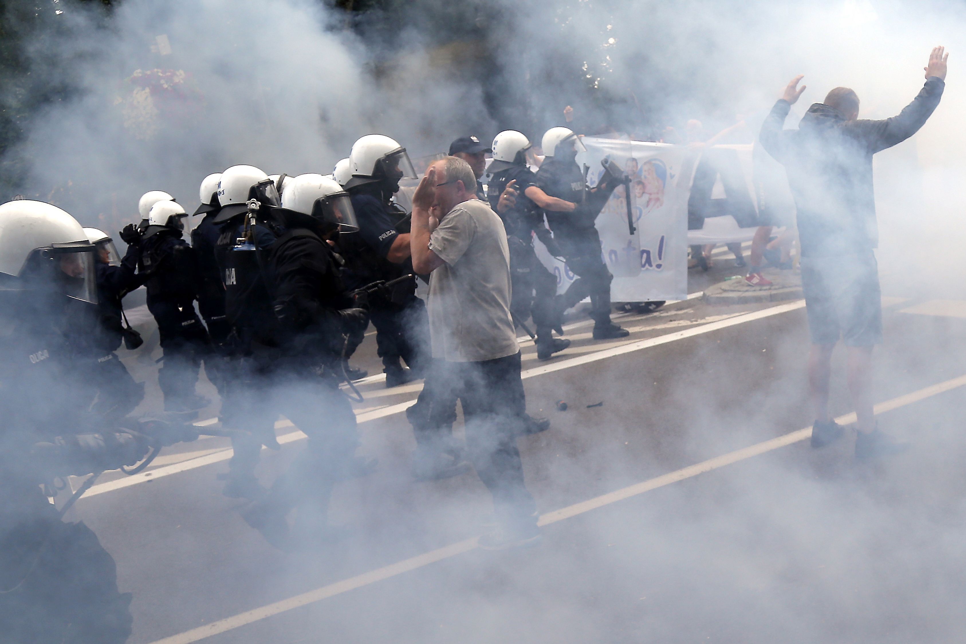 Extremists pelt LGBT people with rocks in attack on Pride march in Poland