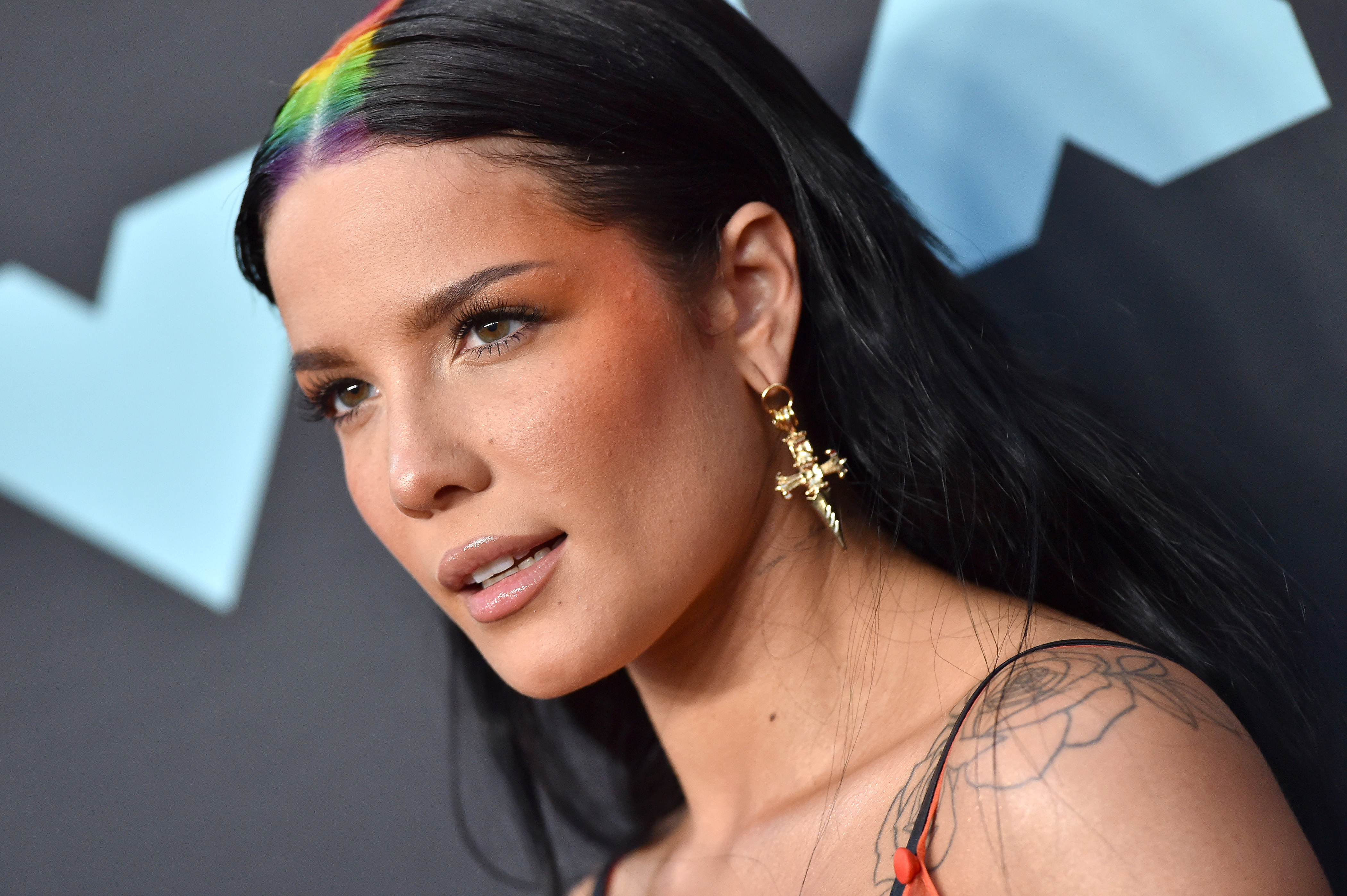 Halsey announces she's pregnant with glorious rainbow baby bump reveal: 'Surprise!'