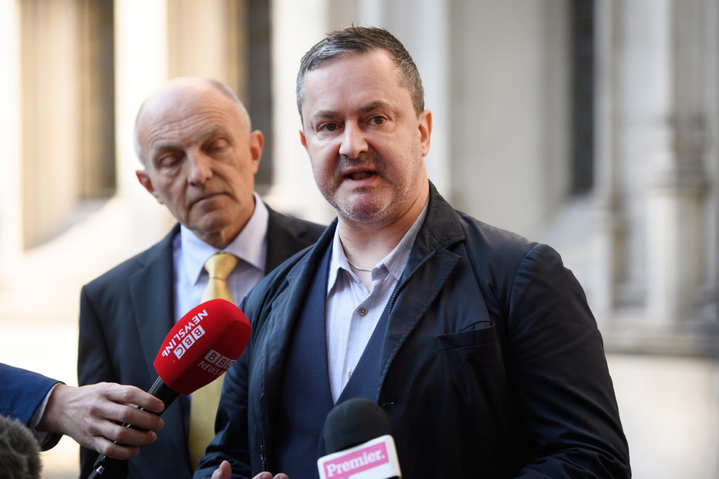 Gareth Lee speaking into a microphone