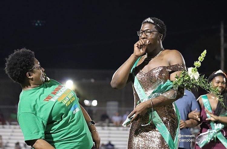 High school teen crowned homecoming royalty in stunning gold gown