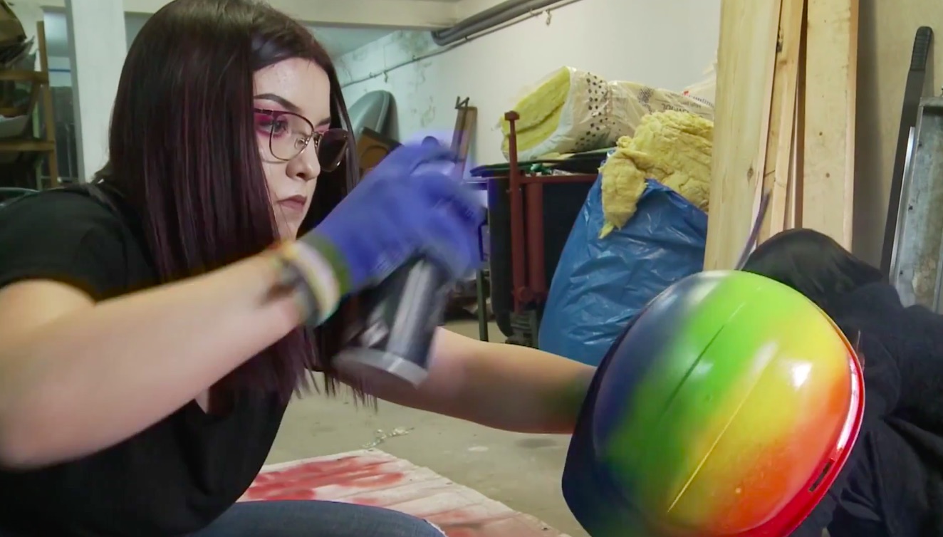 LGBT activist paints hard hats with rainbow colours to keep her safe from anti-gay violence