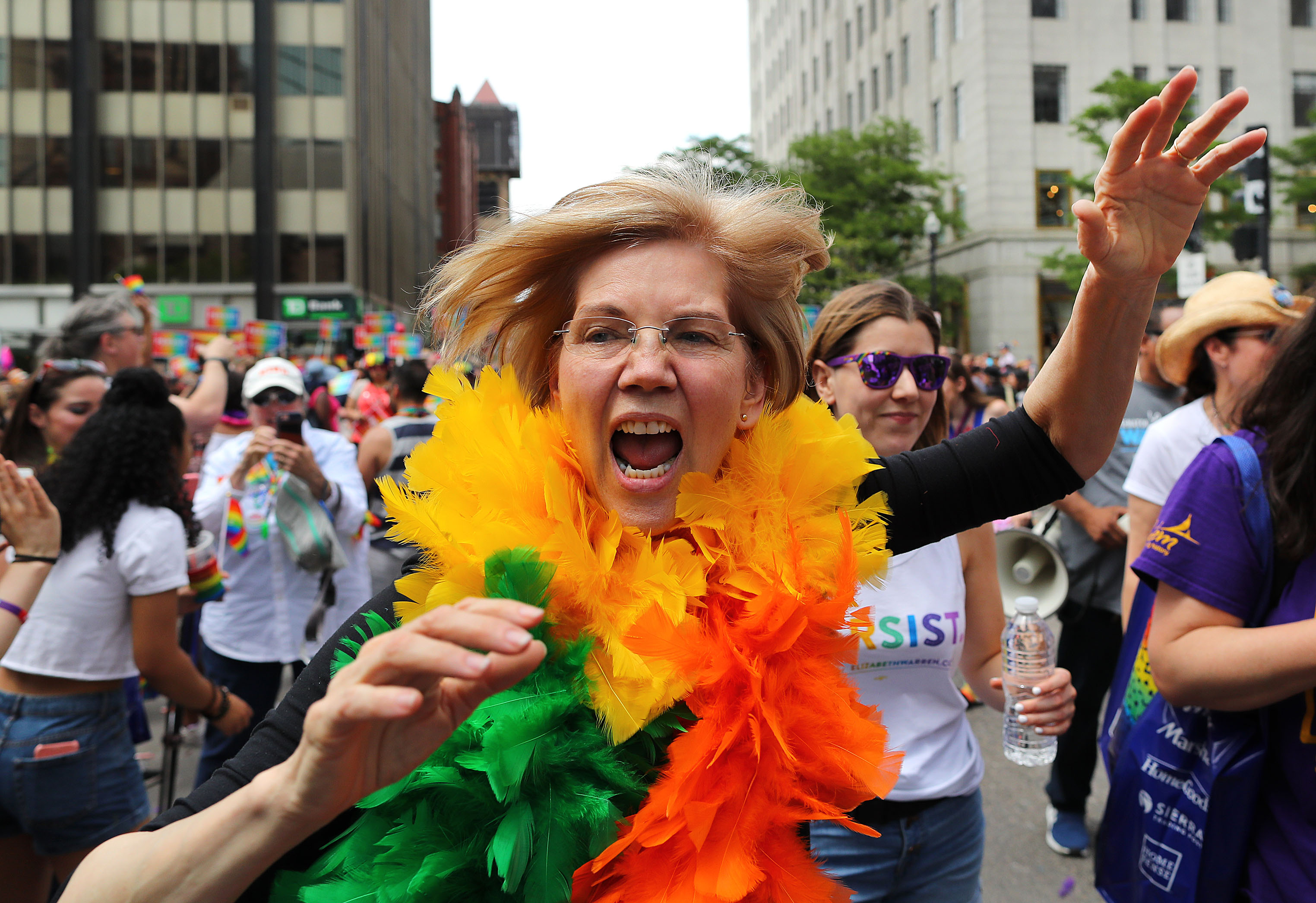 This is how you can march with Elizabeth Warren at Pride in matching rainbow feather boas