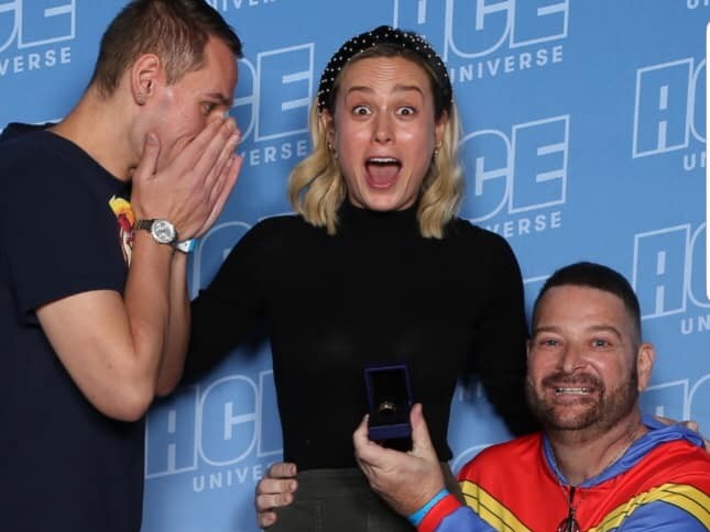 A gay couple got engaged right in front of Brie Larson and her reaction should be framed and hung in the Louvre