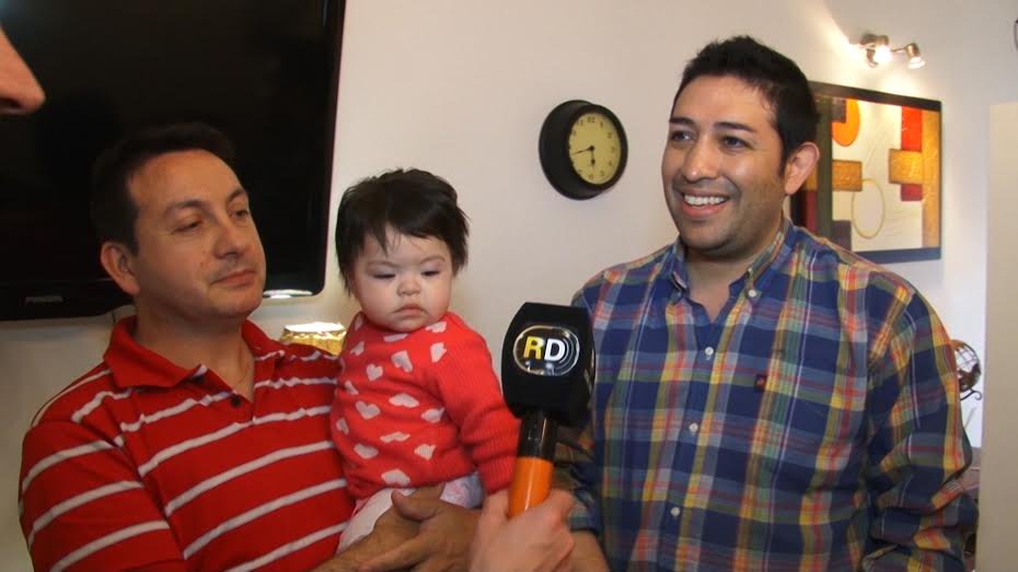 Gay couple adopts baby living with HIV after she was rejected by 10 other families