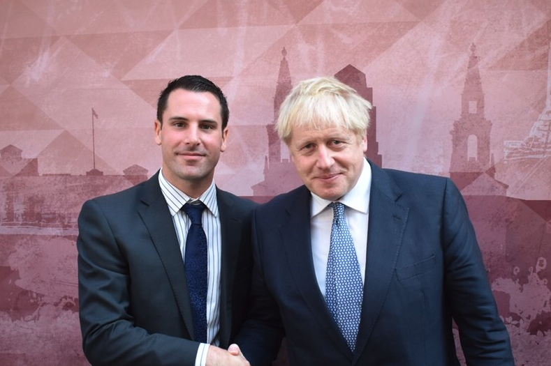 A gay Brexit Party candidate is taking his Tory rival to task over links with a 'homophobic' group