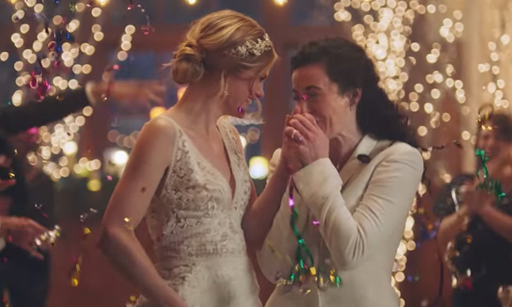 TV channel says it will reinstate 30 second TV ad featuring lesbian kiss after Ellen DeGeneres intervenes