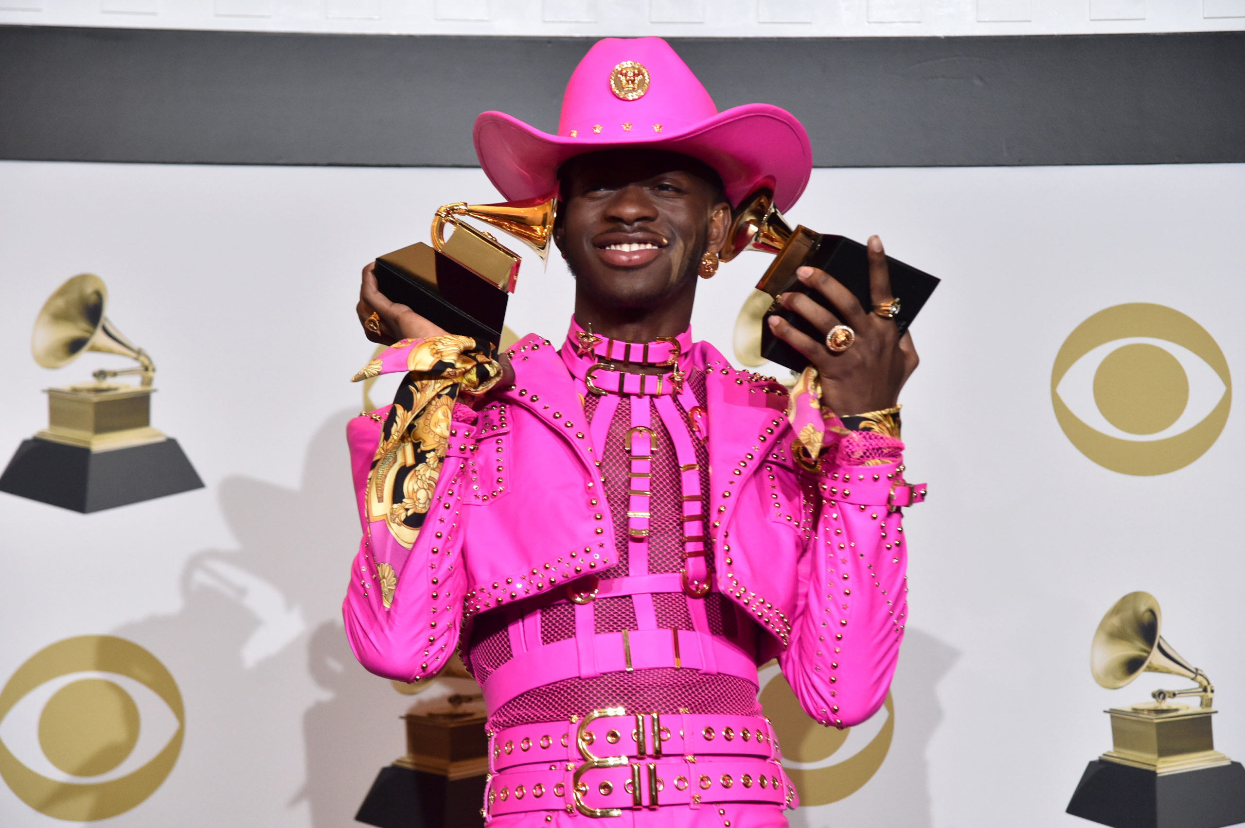 Lil Nas X wins big at the Grammys in all-pink Versace 'cowboy dominatrix' outfit