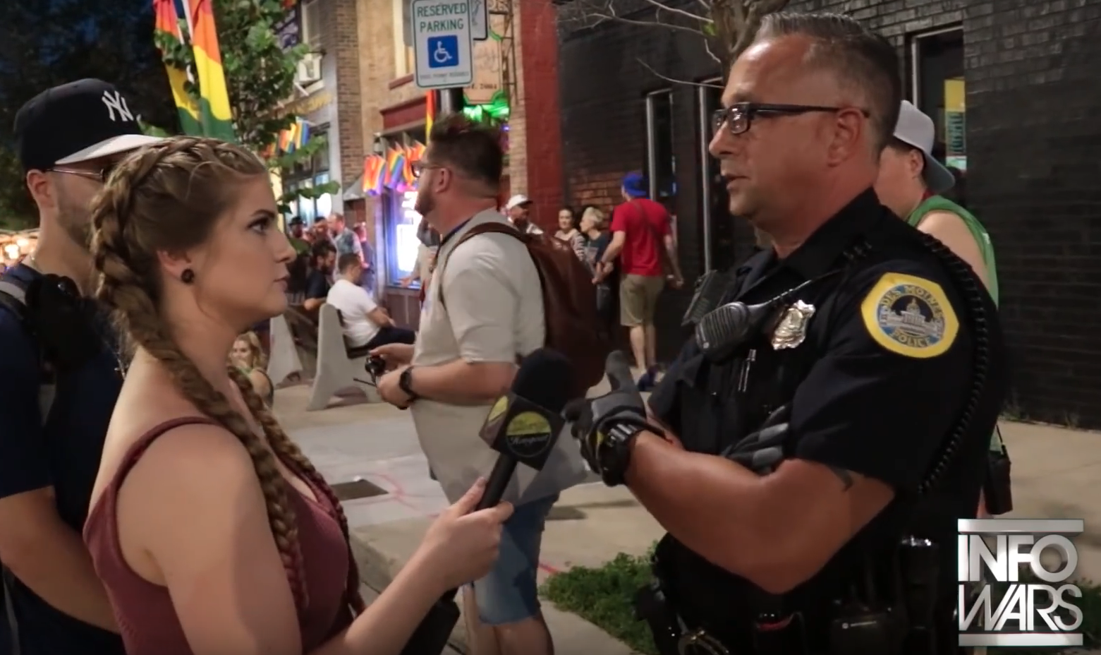 Everyone's least-favourite far-right gun activist gets epically shut down by cop at Pride parade