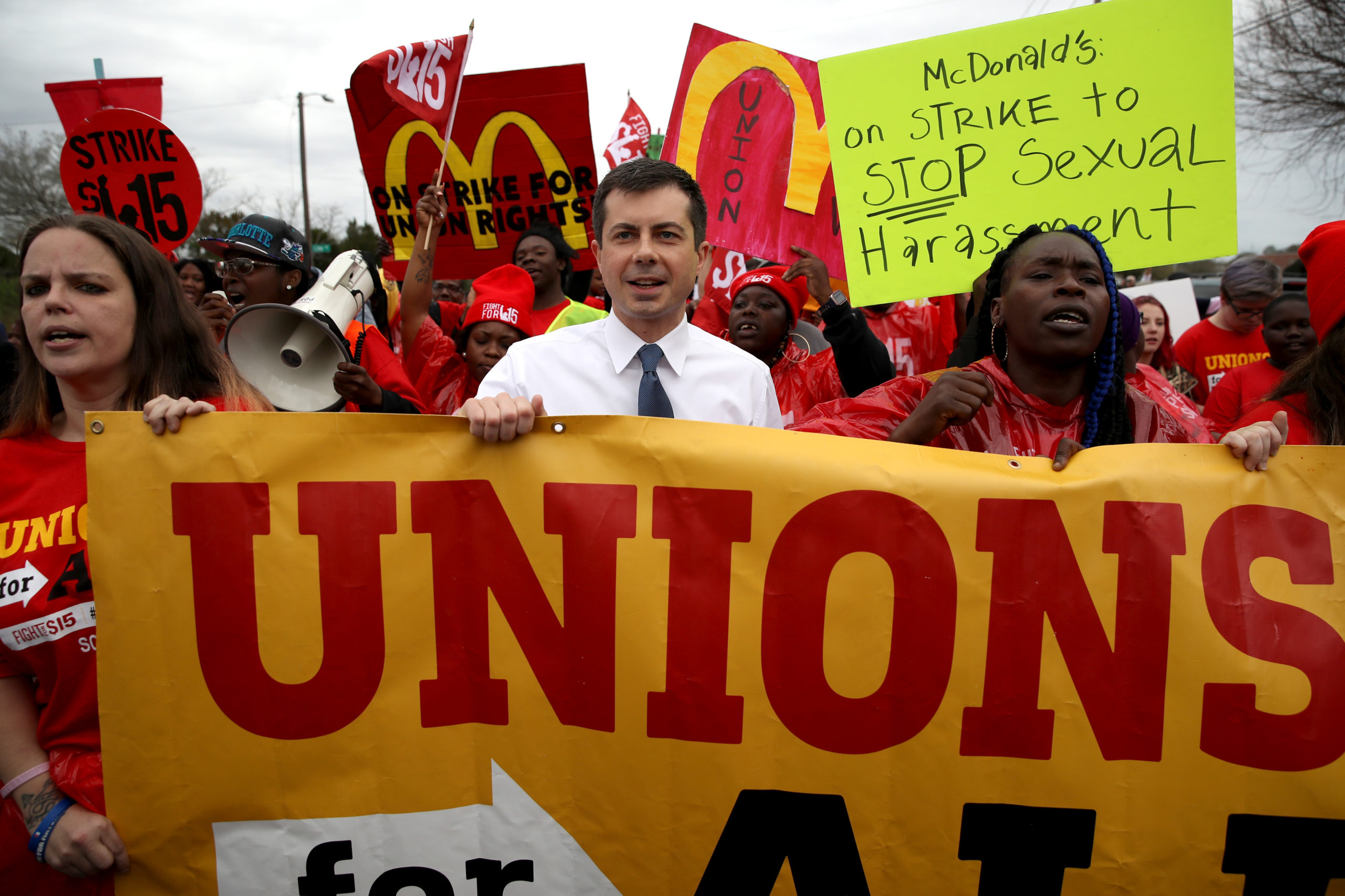 Pete Buttigieg marched at a minimum wage rally and people are pointing out the hypocrisy