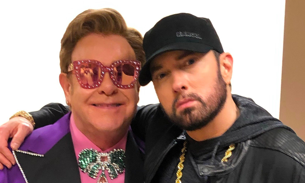 Eminem reunited with his 'Uncle' Elton John at the Oscars... 15 years after the rapper bought the singer a set of c**k rings