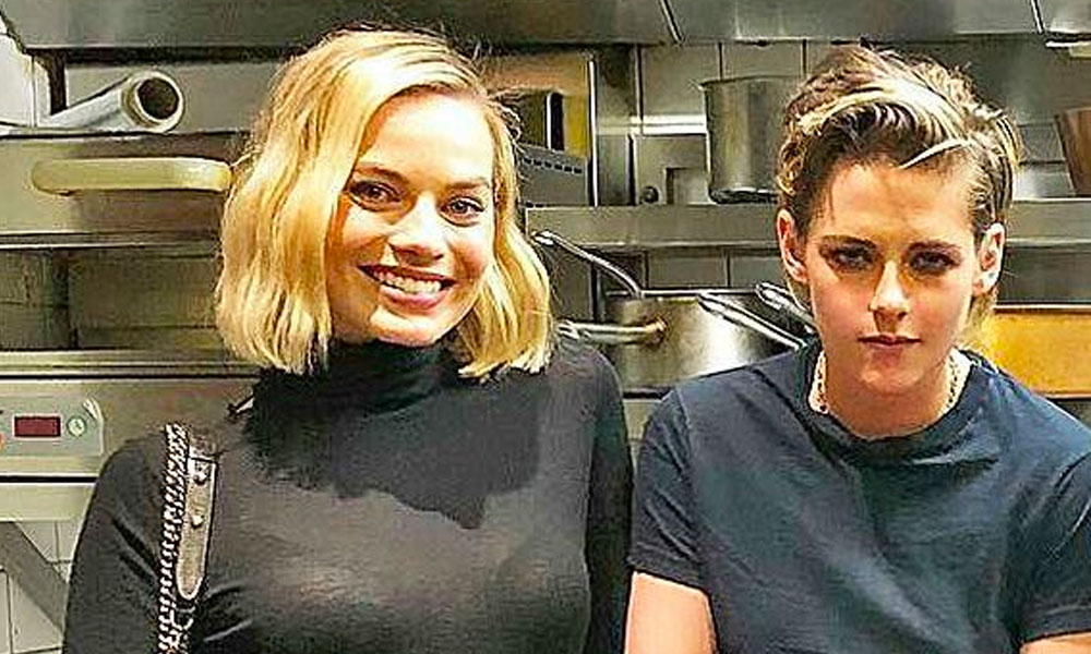 This photo of Kristen Stewart and Margot Robbie has infinite queer energy and belongs in the Sistine Chapel