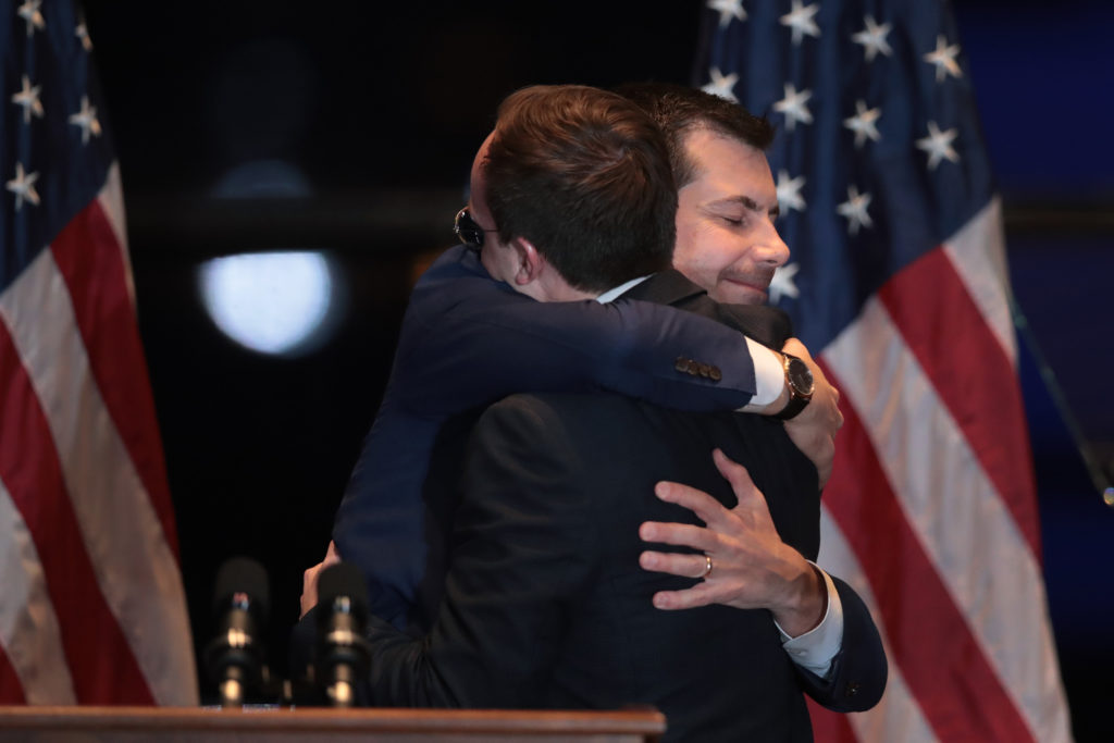 Former South Bend, Indiana Mayor Pete Buttigieg hugs his husband Chasten after announcing he was ending his campaign to be the Democratic nominee for president. (Scott Olson/Getty Images)