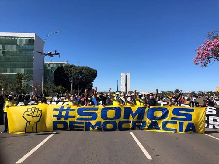 Brazilian football fans put aside fierce, century-old rivalry to protest 'homophobic, racist' president Jair Bolsonaro