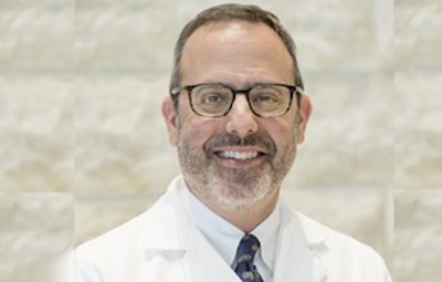 Beloved gay doctor dies from coronavirus in his husband's arms after months of battling the pandemic on the front line