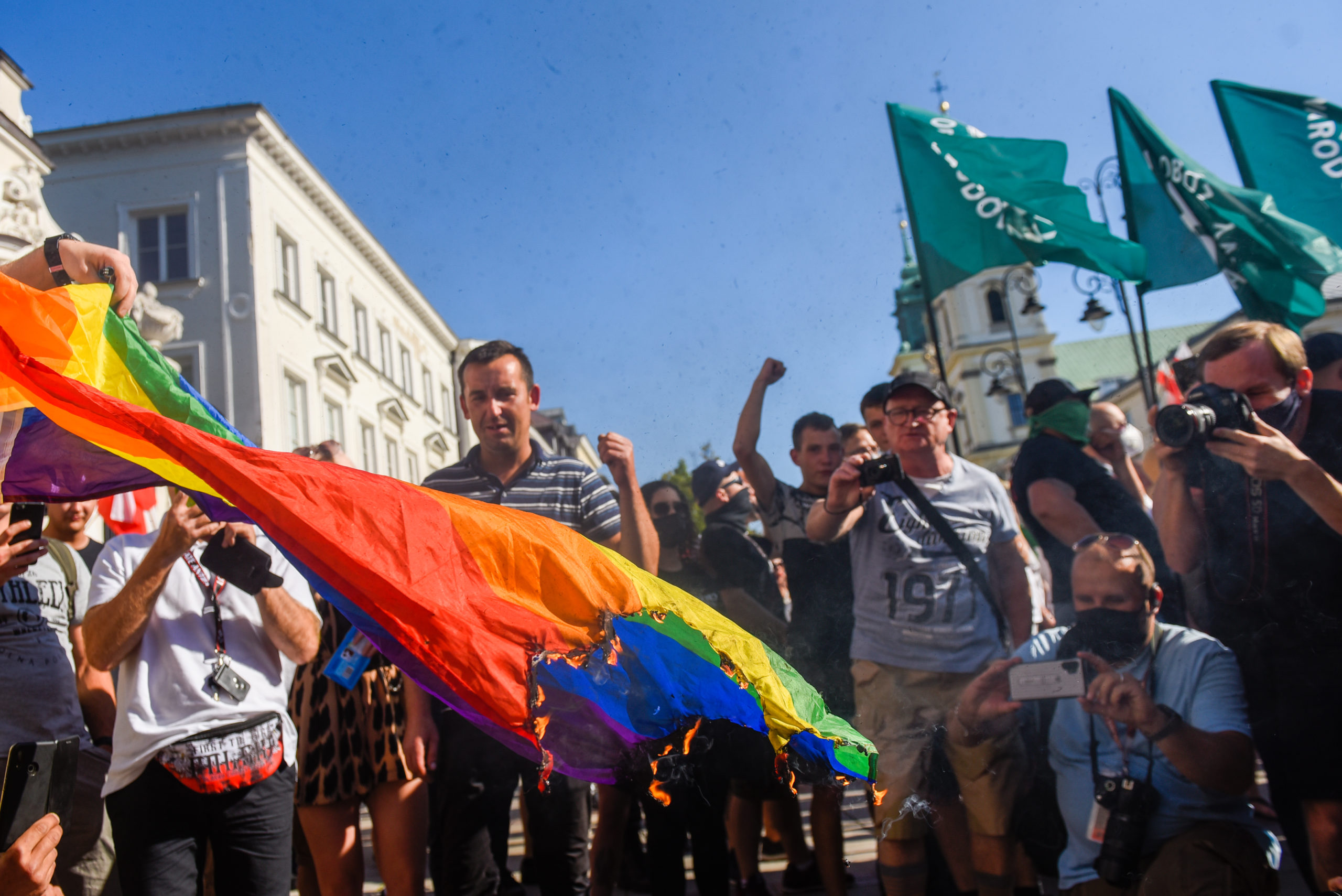 Homophobic thugs take to the streets in Warsaw, Poland, to burn flame-resistant rainbow flags and demand a ban on Prides
