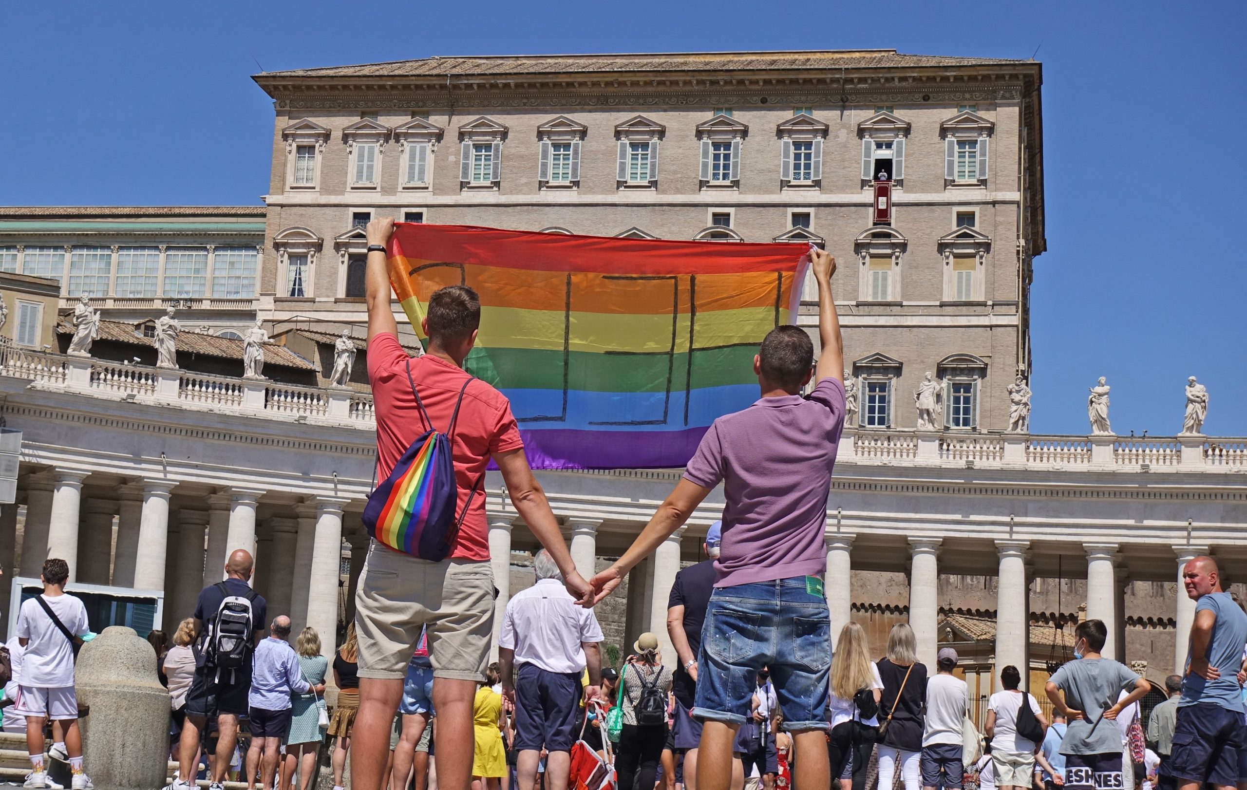 Polish gay couple travel to the Vatican to unfurl a giant Pride flag in front of Pope Francis, begging for 'help'