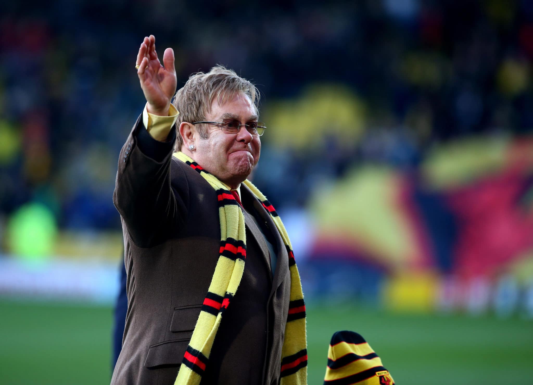Elton John says the 'horrible things' football fans shouted kept him grounded at the height of his fame