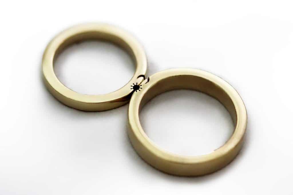 Matching sun and moon wedding bands. (Etsy/CADIjewelry)