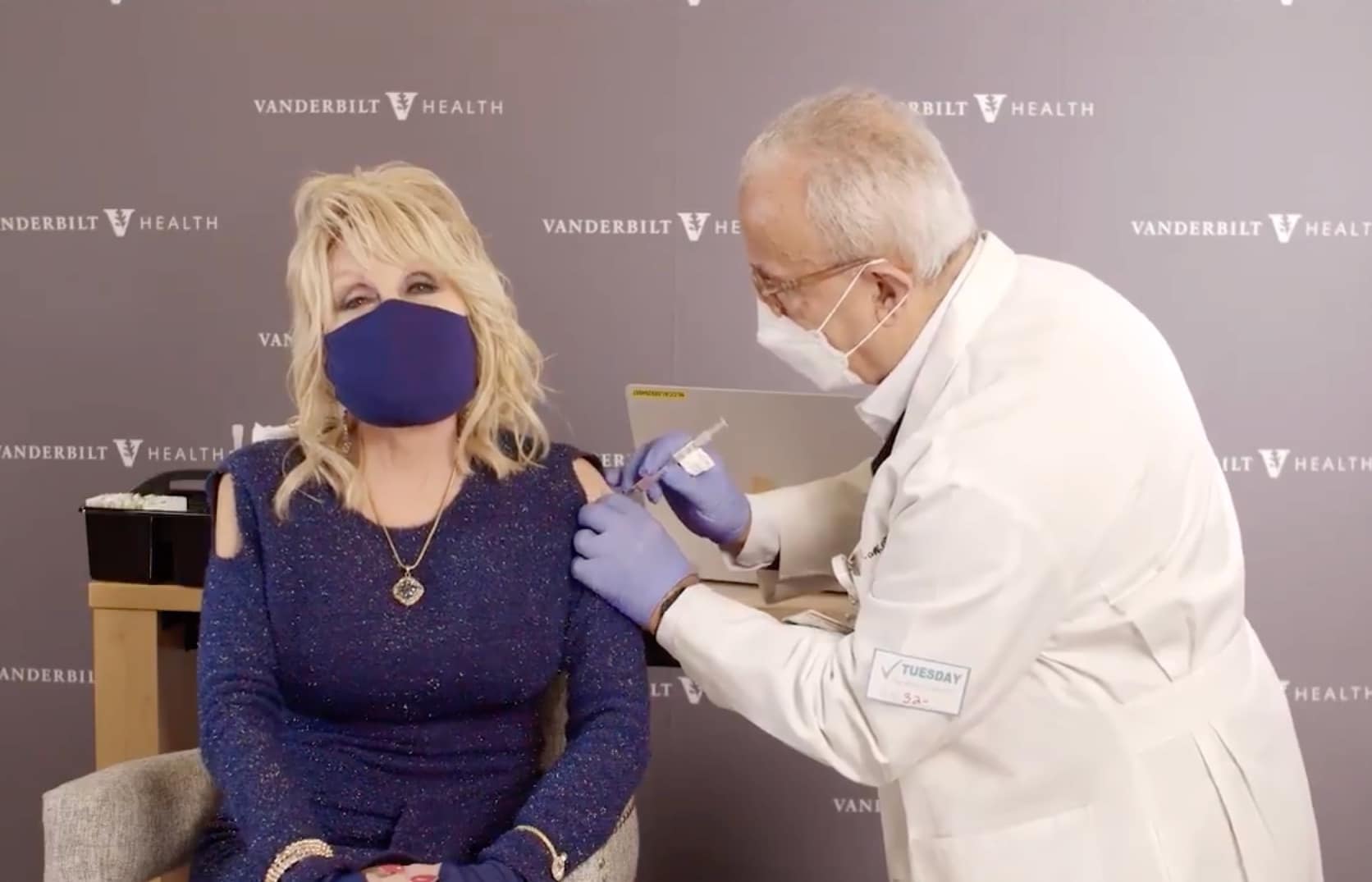 Saint Dolly Parton gives her most iconic hit a vaccine rewrite while getting COVID jab she helped fund