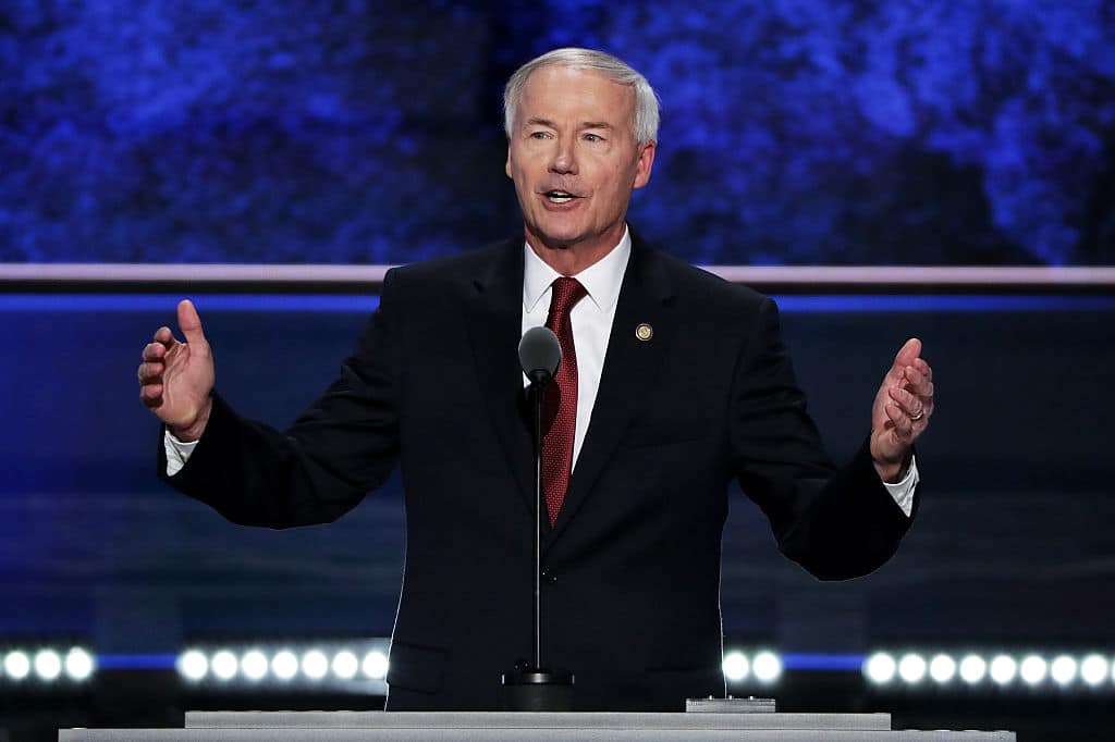 Arkansas governor apologises to trans youth after 'extreme' healthcare ban forced through