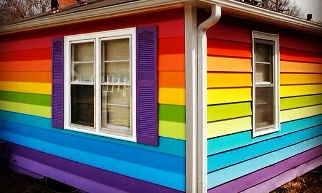House opposite homophobic hate group Westboro Baptist Church painted in defiant Pride flag colours