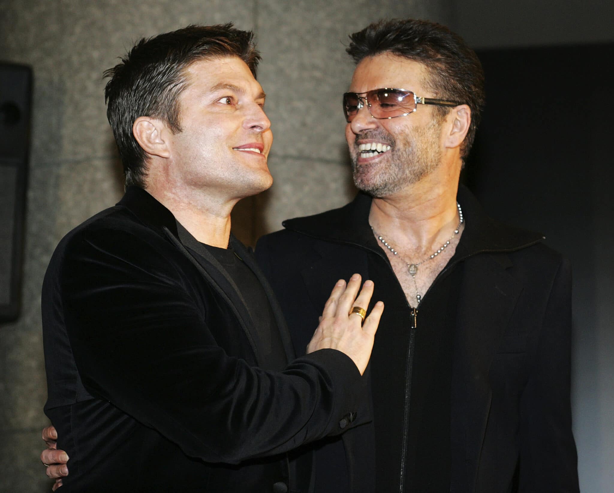 The late George Michael and his partner Kenny Goss a