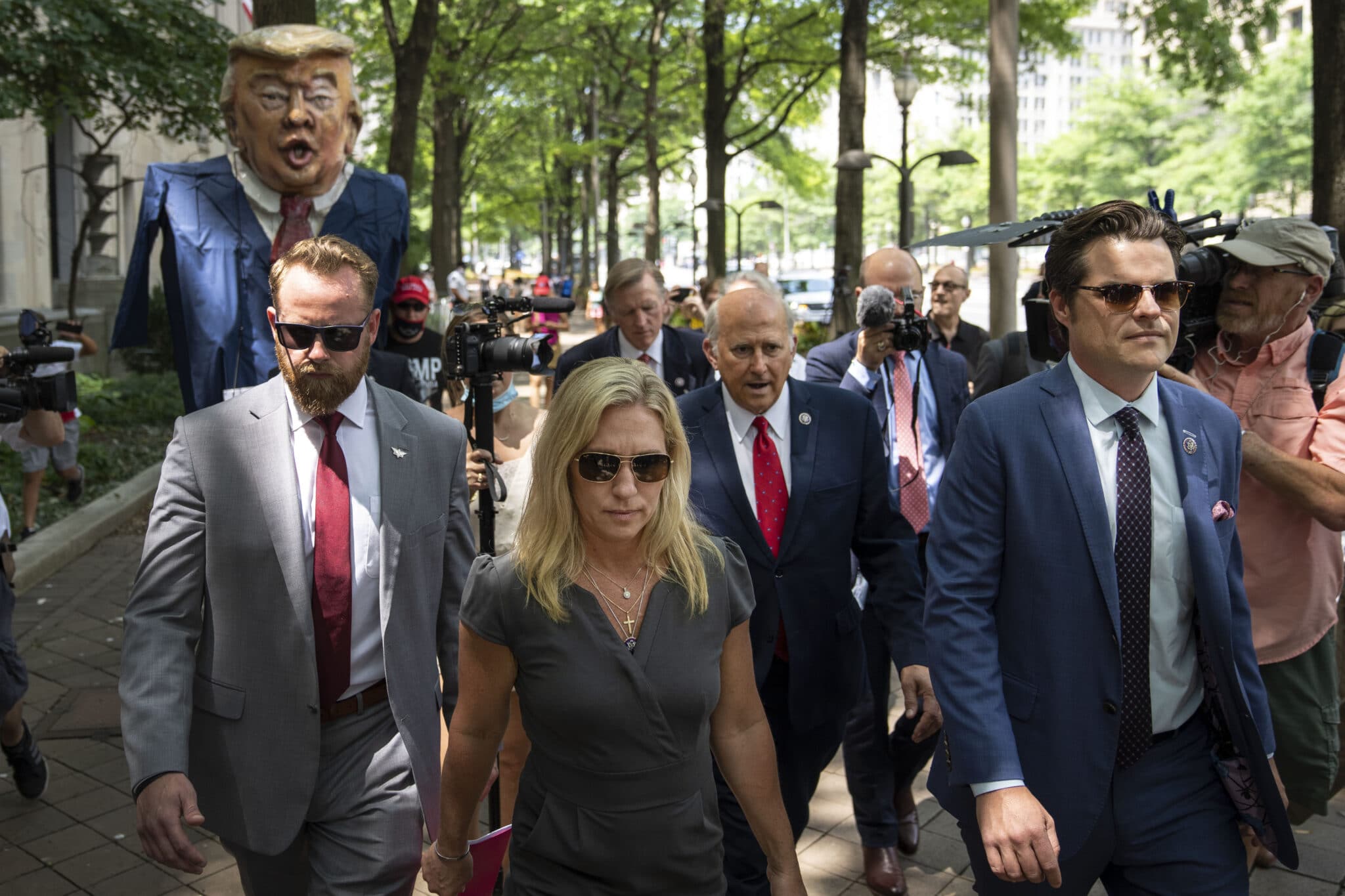 Marjorie Taylor Greene literally runs away from critics then whines about free speech