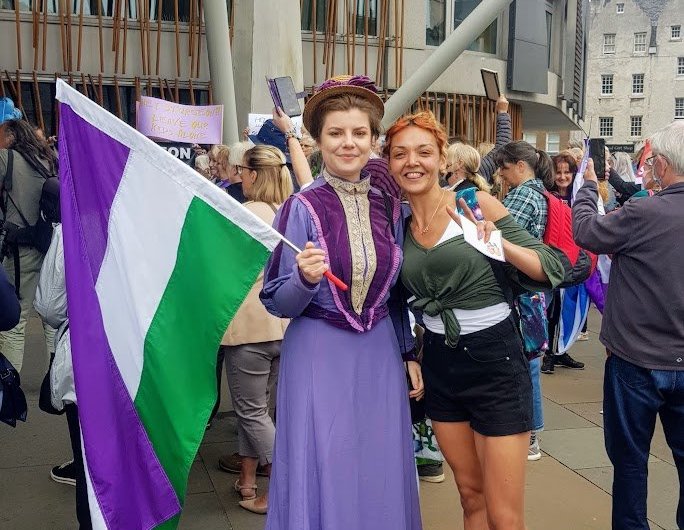 Anti-trans protesters wearing suffragette colours boo Nicola Sturgeon without a hint of irony