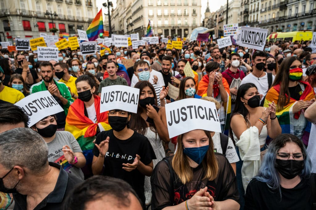 Protesters carrying placards and flags