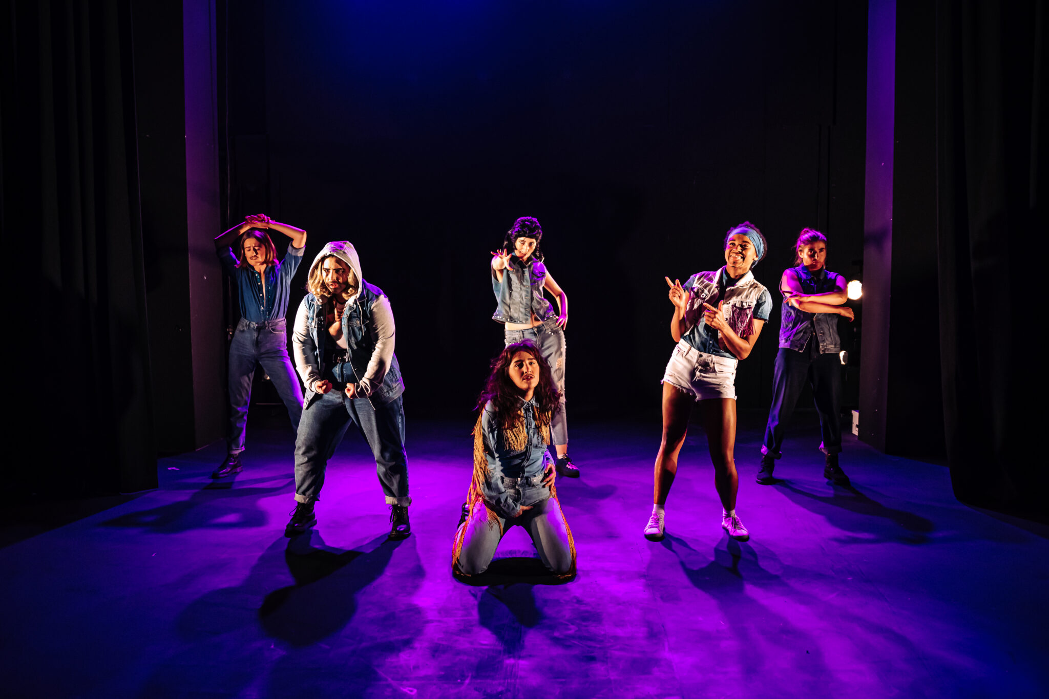 Drag king group Pecs on stage.