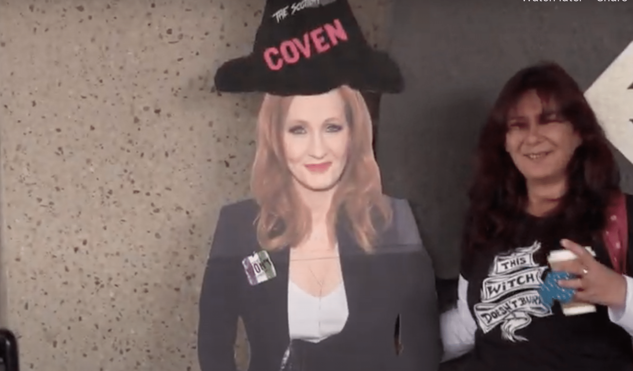 Protesters pose with a cardboard cutout of JK Rowling