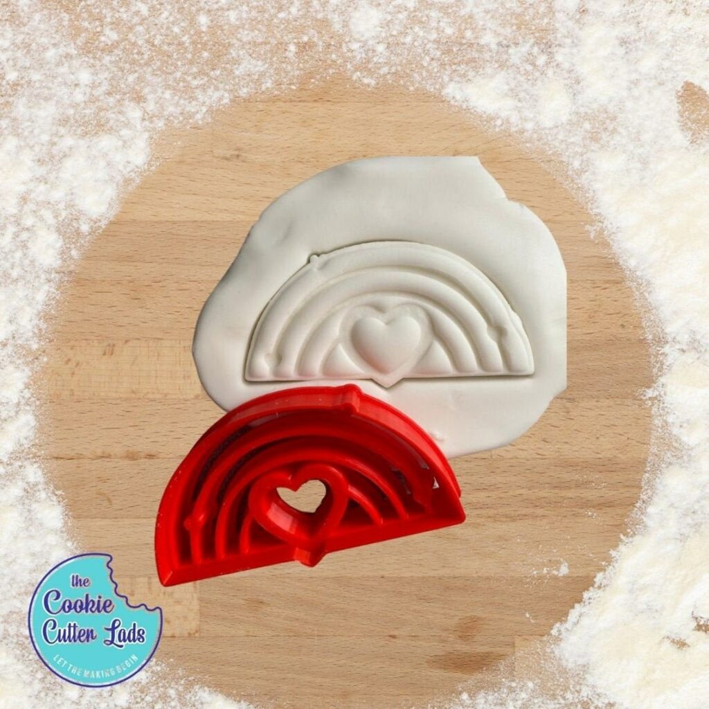 A cute rainbow cookie cutter. (Etsy/thecookiecutterlads)