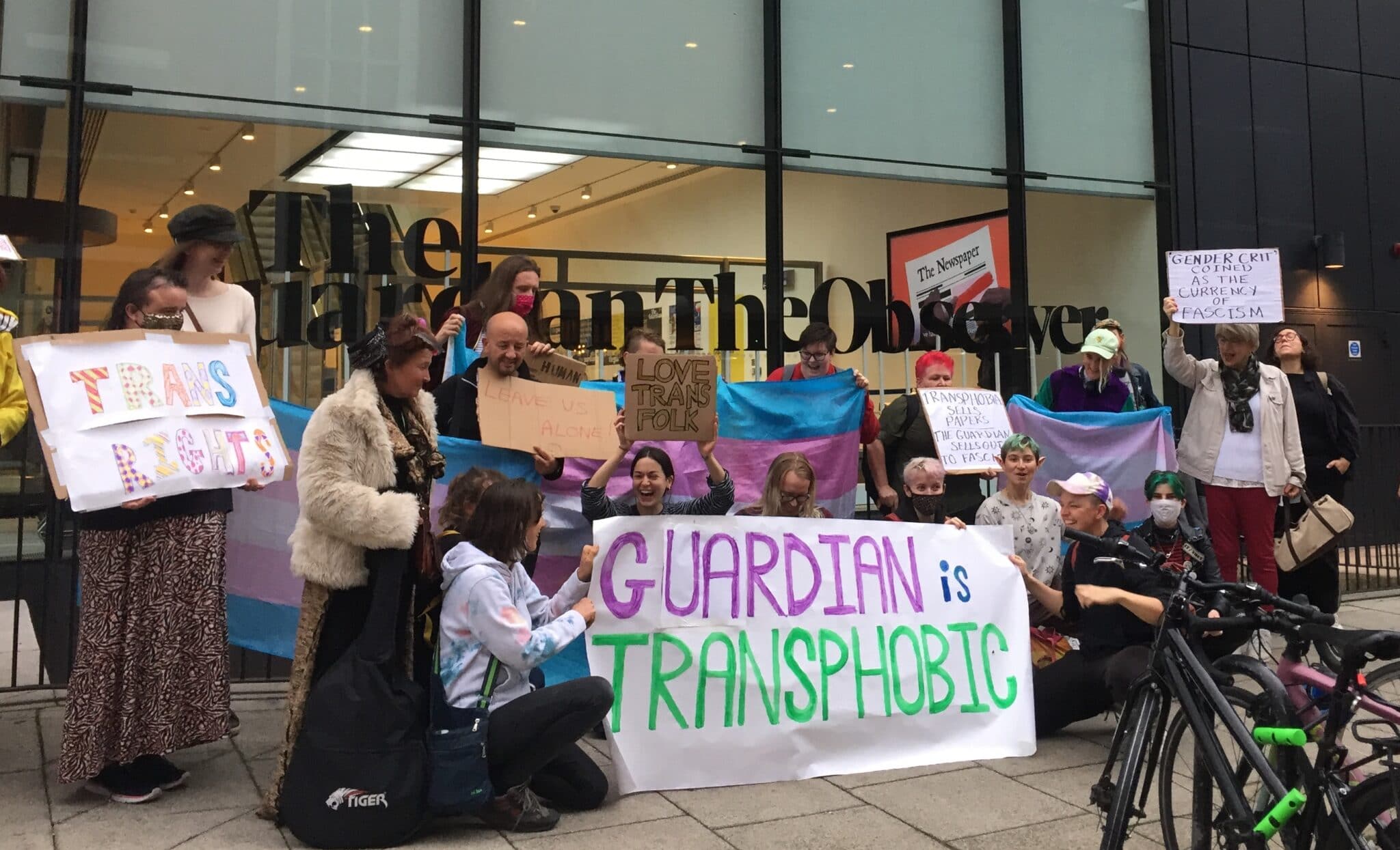 Protesters demand the Guardian 'stop platforming transphobia' outside newspaper's HQ