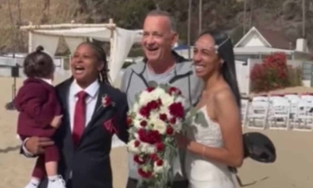 Tom Hanks crashes beach wedding and gushes over happy couple: 'Most beautiful ceremony ever'