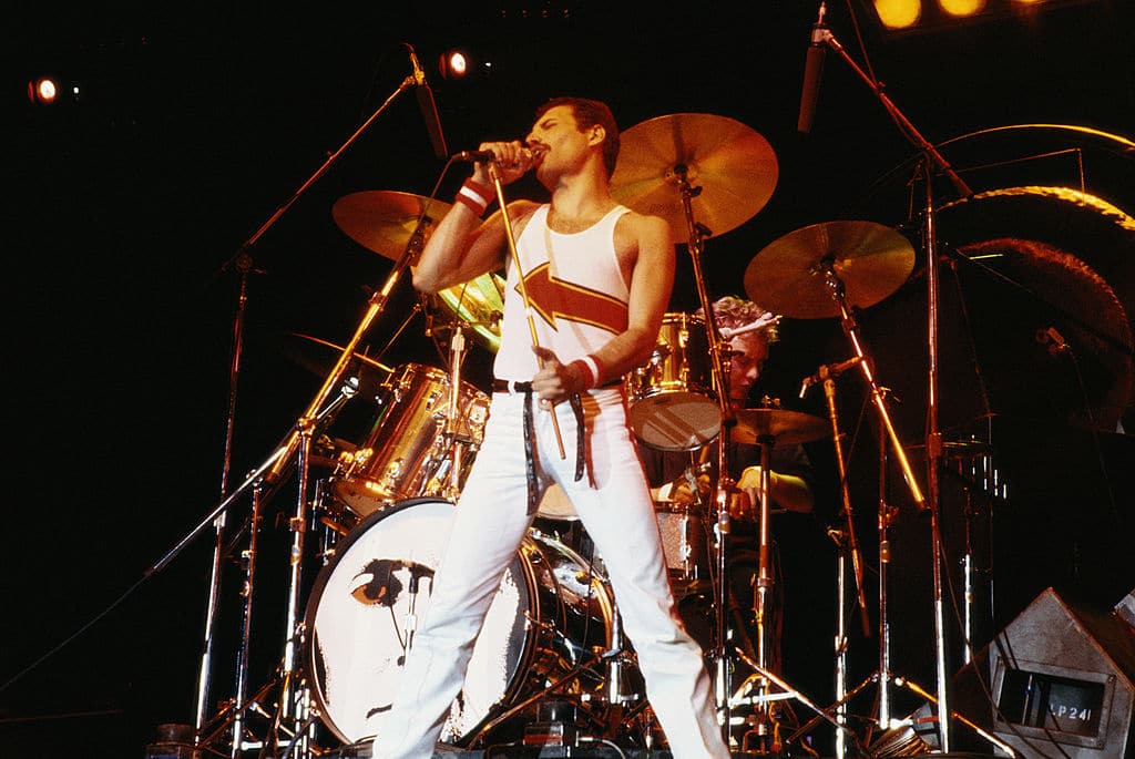 Freddie Mercury performing on stage