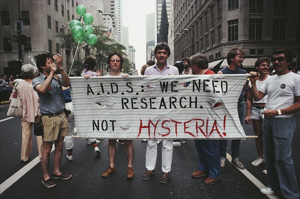 Marchers on a Gay Pride parade through Manhattan, New York City, carry a banner which reads 